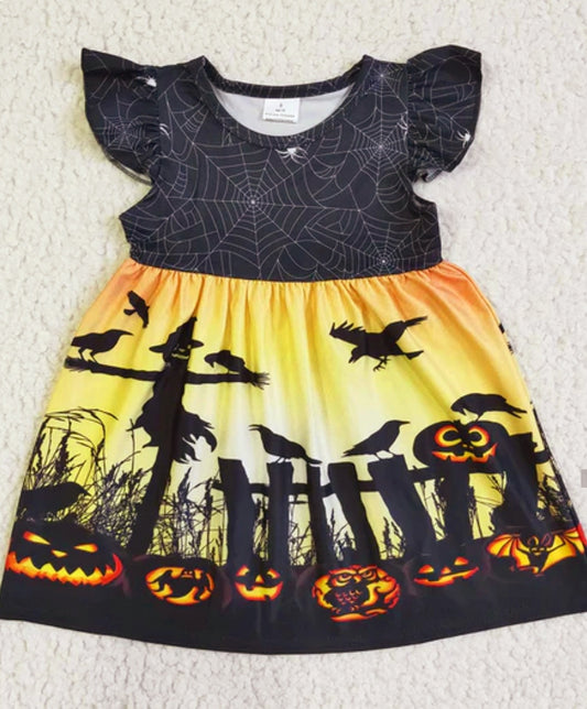 pumpkins sitting on a fence dress